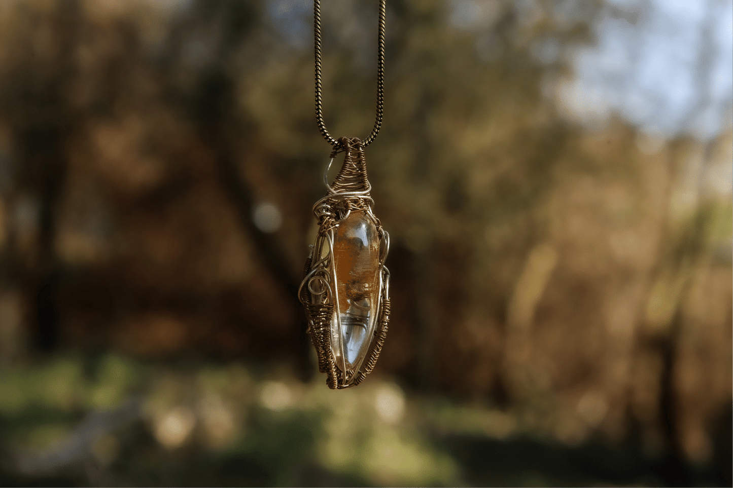 Wire-wrapped mystic jewellry from India combines the power of healing stones with natural metal elements. Handmade, unique, tree agate gemstone pendant.
