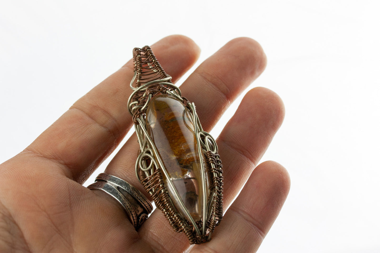 Wire-wrapped mystic jewellry from India combines the power of healing stones with natural metal elements. Handmade, unique, tree agate gemstone pendant.