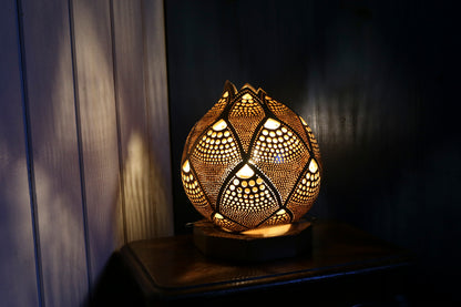 Lámpara de calabaza con resplandor tranquilo