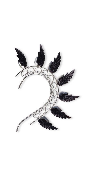 Decorative headband with black feather-like attachments on a white background

