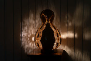 Handcrafted, Calabash lamp, Dried gourd, Intricate carving, Patterns, Soft light, Elegance, Decoration, Unique design, Warm glow.