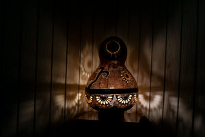 Collection, Calabash lamps, Unique, Carvings, Sizes, Serene ambiance, Soft glow, Decorative lighting, Elegance, Patterns.