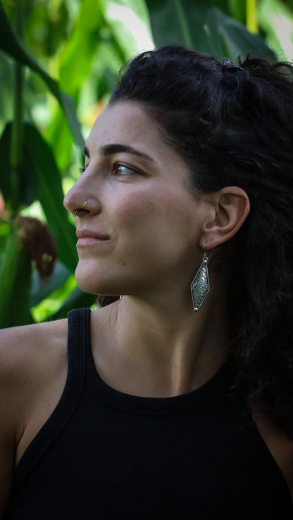 Silver Newari earrings with intricate traditional Nepalese designs and cultural craftsmanship
