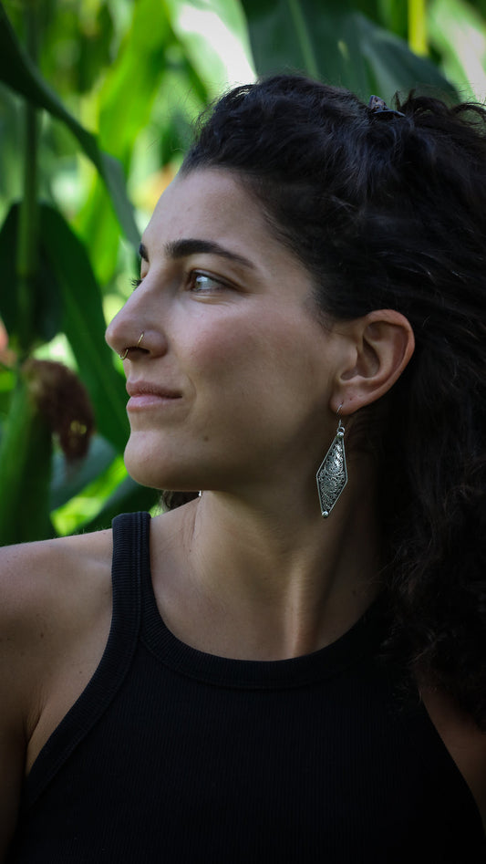 Silver Newari earrings with intricate traditional Nepalese designs and cultural craftsmanship