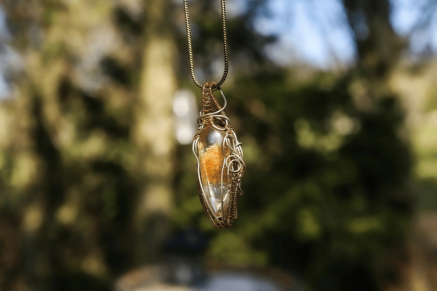 Wire-wrapped mystic jewellry from India combines the power of healing stones with natural metal elements. Handmade, unique, tree agate gemstone pendant. 