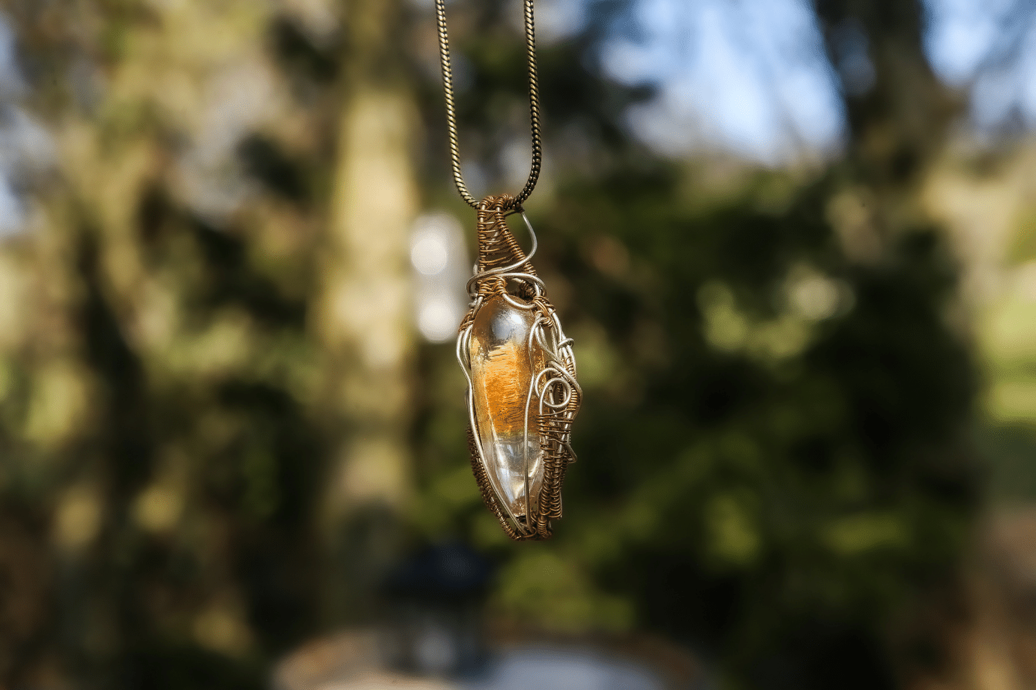 Wire-wrapped mystic jewellry from India combines the power of healing stones with natural metal elements. Handmade, unique, tree agate gemstone pendant. 