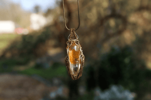 Wire-wrapped mystic jewellry from India combines the power of healing stones with natural metal elements. Handmade, unique, tree agate gemstone pendant. 