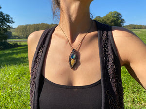 Wire-wrapped mystic jewellry from India combines the power of healing stones with natural metal elements. Handmade, unique, fossil, gemstone pendant. 